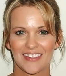 Woman smiling at camera showcasing dental results from orthodontic treatment