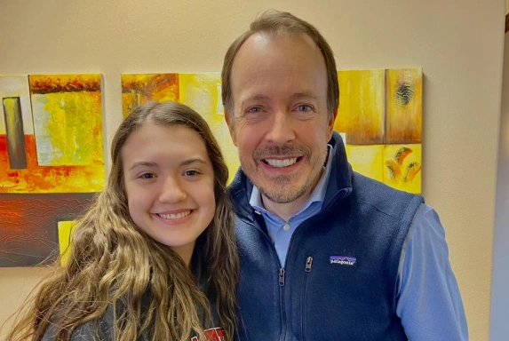 Orthodontist with patient at Dallas orthodontic clinic providing personalized smile alignment care